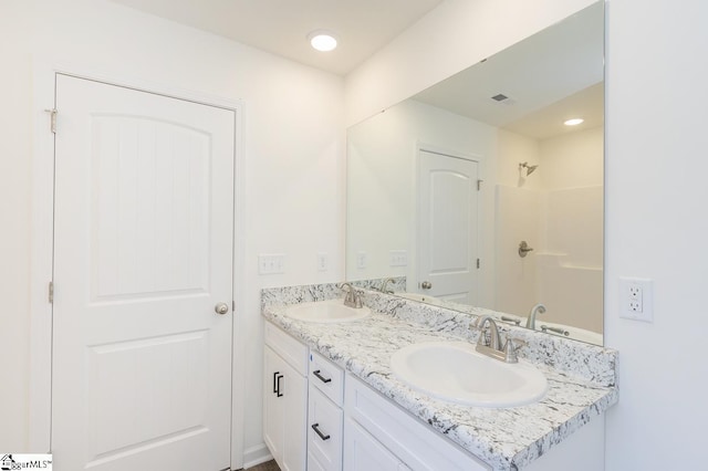 bathroom featuring vanity and walk in shower