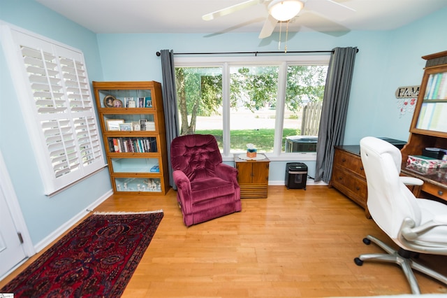 office space with ceiling fan and light wood-type flooring