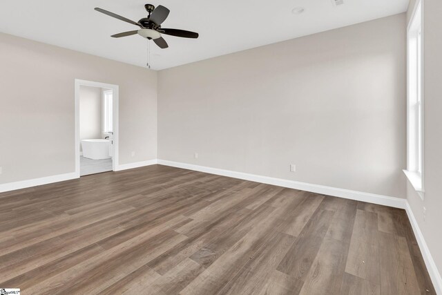 empty room with wood-type flooring and ceiling fan