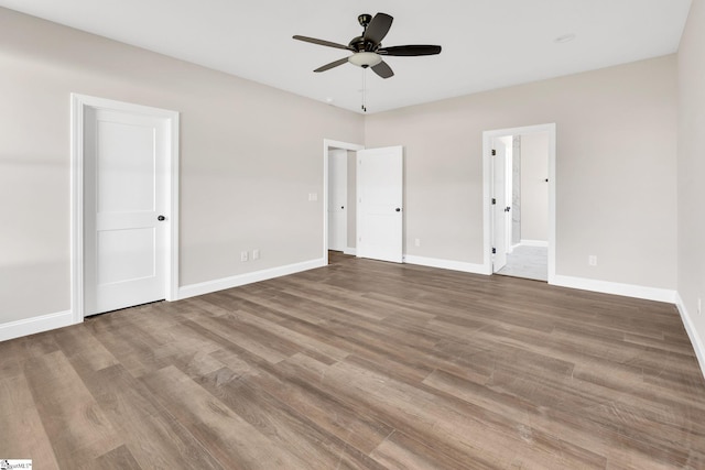 unfurnished bedroom featuring wood-type flooring and ceiling fan