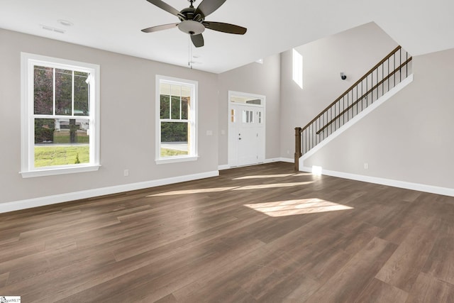 entryway with dark hardwood / wood-style floors and ceiling fan