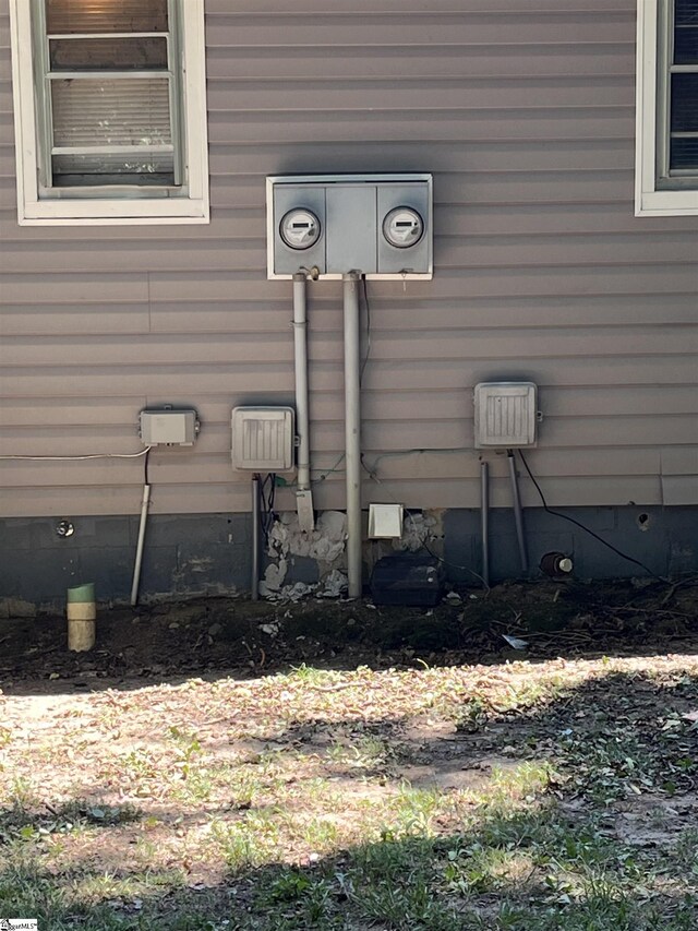 exterior details featuring electric meter