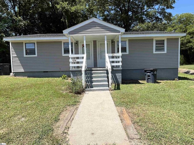 view of front of home with crawl space, a porch, and a front yard