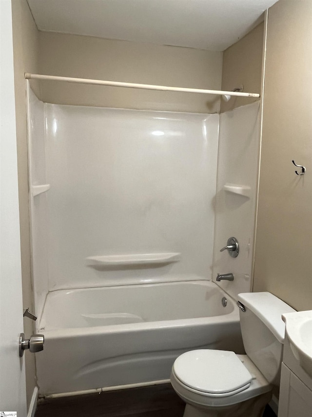 bathroom featuring tub / shower combination, vanity, and toilet