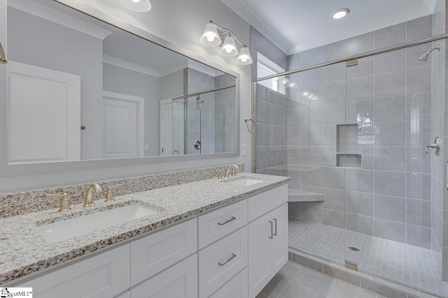 bathroom featuring crown molding, tile patterned flooring, an enclosed shower, and vanity