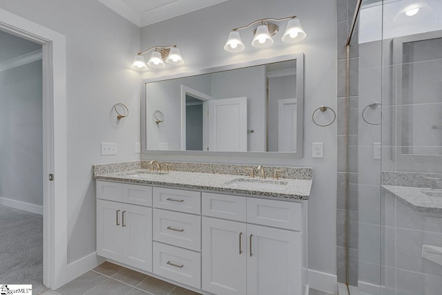 bathroom with tile patterned floors and vanity