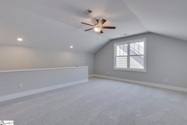 additional living space featuring ceiling fan, carpet flooring, and vaulted ceiling