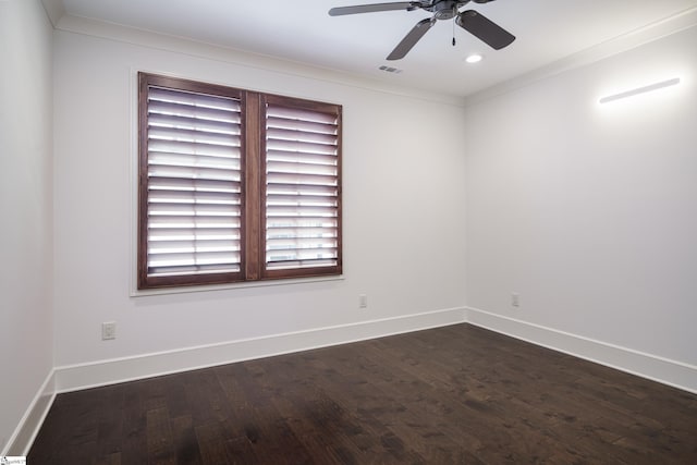 spare room with ornamental molding, ceiling fan, and dark hardwood / wood-style flooring