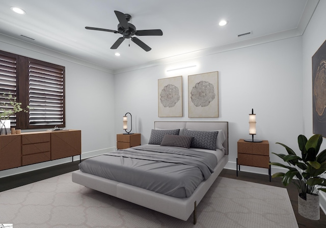 bedroom with crown molding, hardwood / wood-style floors, and ceiling fan