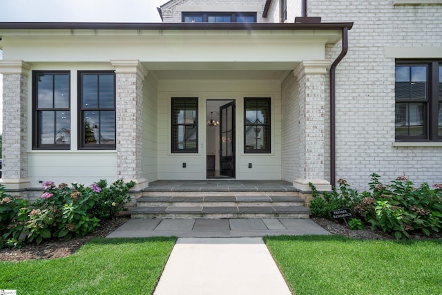 view of exterior entry featuring a porch