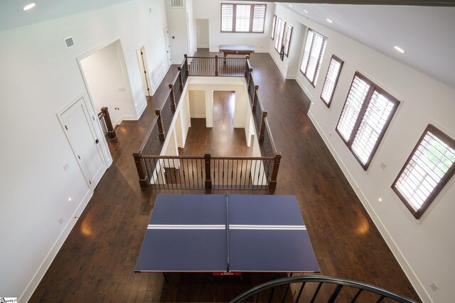 interior space featuring hardwood / wood-style floors and high vaulted ceiling