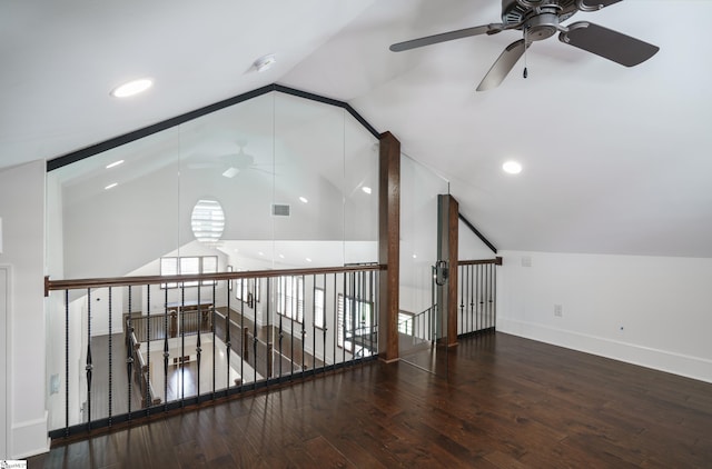 additional living space with vaulted ceiling, hardwood / wood-style flooring, and ceiling fan