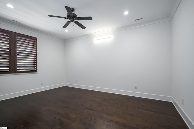 spare room featuring ceiling fan, ornamental molding, and dark hardwood / wood-style floors