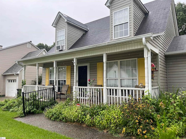 view of front facade with a garage and a porch