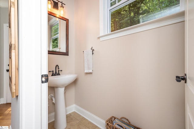 bathroom featuring tile patterned floors and a healthy amount of sunlight