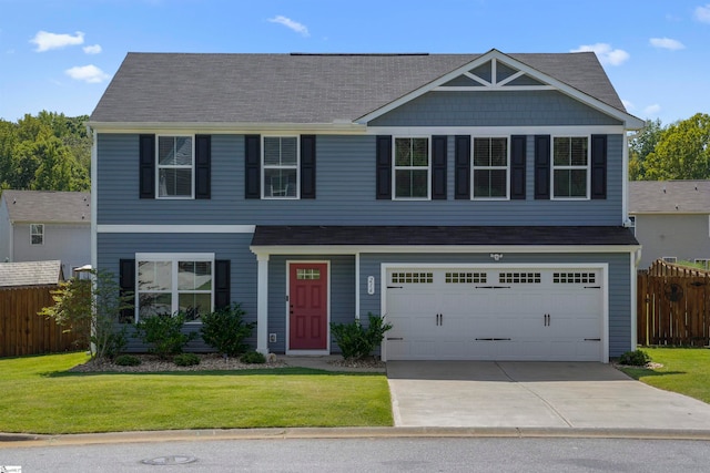 view of front of property featuring a garage and a front lawn