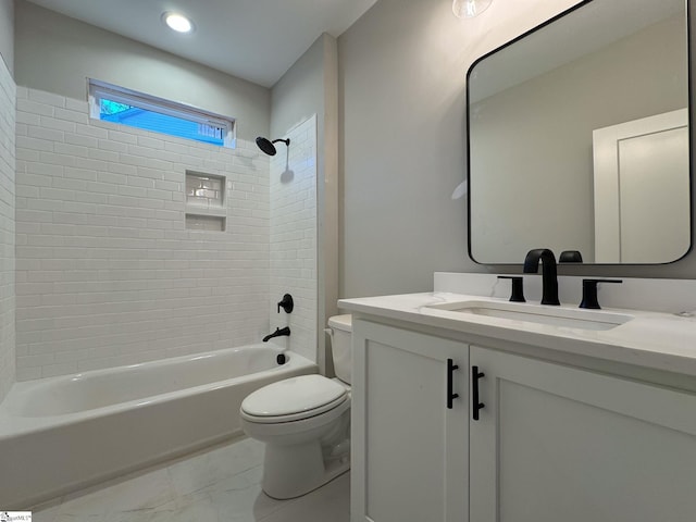 full bath featuring marble finish floor, shower / bath combination, vanity, and toilet