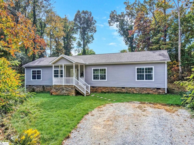 ranch-style house featuring a porch, a front yard, and crawl space