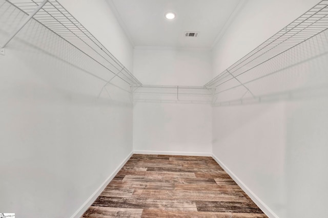 spacious closet with visible vents and wood finished floors