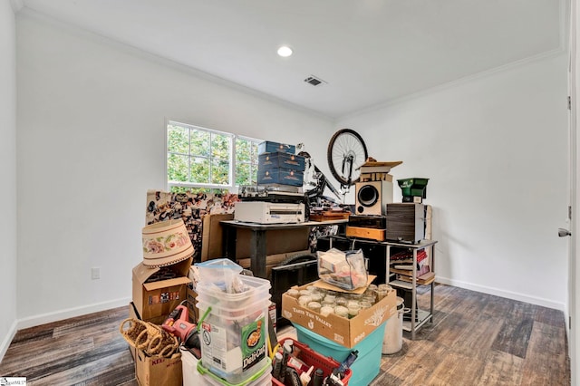 misc room featuring baseboards, wood finished floors, and ornamental molding