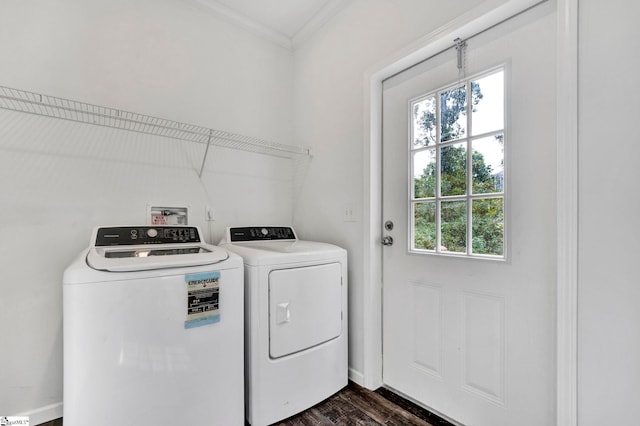 laundry room featuring ornamental molding, laundry area, separate washer and dryer, and dark wood-type flooring