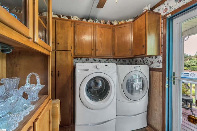 laundry area featuring ceiling fan, washing machine and clothes dryer, cabinets, and hardwood / wood-style floors