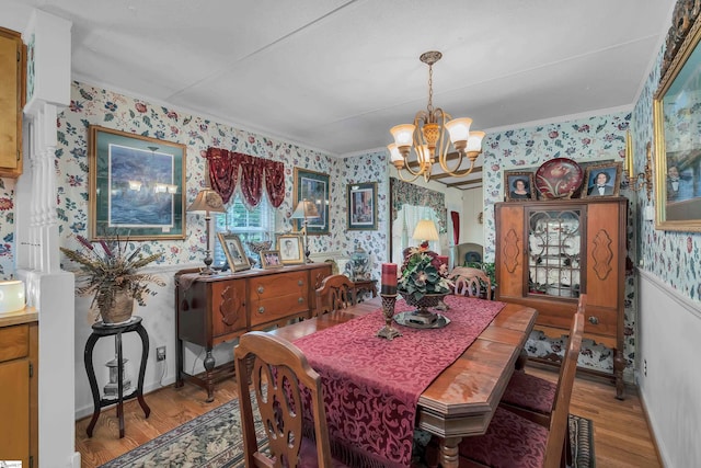 dining area with an inviting chandelier and hardwood / wood-style floors