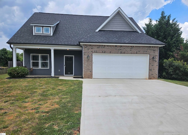 view of front of house with a garage and a front yard