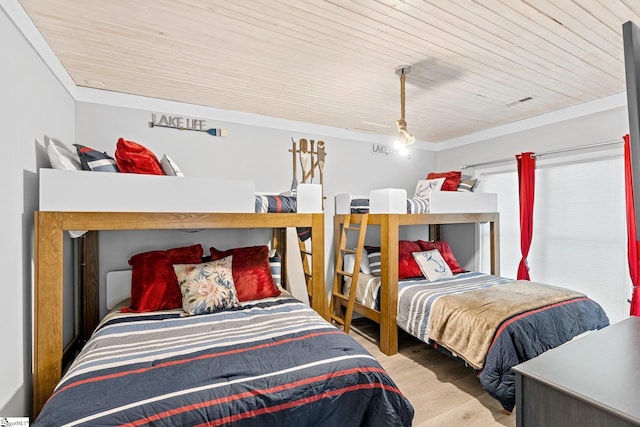 bedroom with wooden ceiling and light wood-type flooring