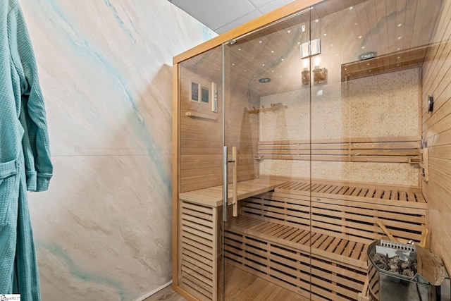 view of sauna / steam room featuring wooden walls