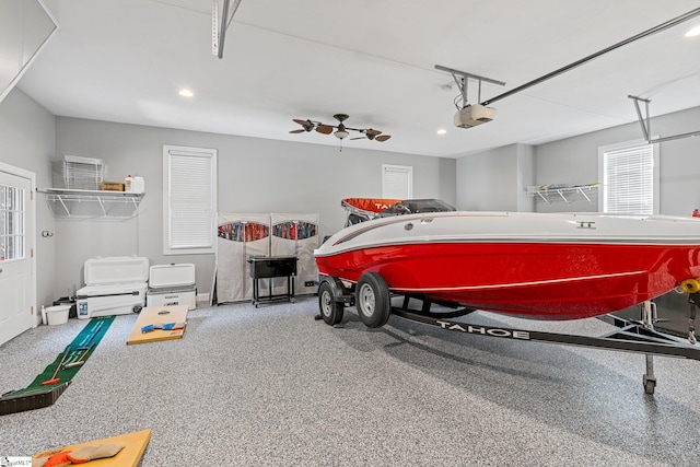 garage featuring ceiling fan and a garage door opener