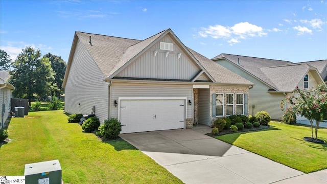 craftsman inspired home with a front yard and a garage