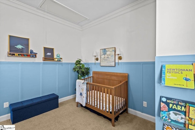 carpeted bedroom featuring a crib and ornamental molding