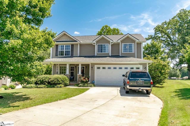 craftsman house with a front lawn and a garage