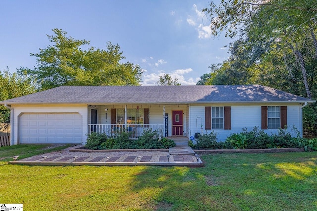 ranch-style house featuring a garage, a front yard, and covered porch