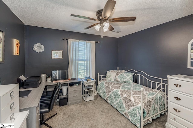 bedroom with light colored carpet, a textured ceiling, and ceiling fan