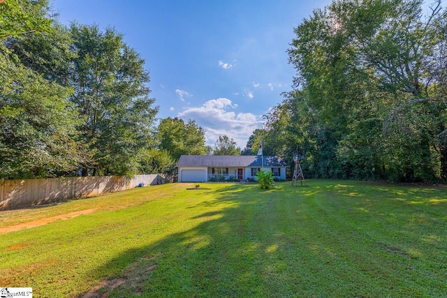 view of yard with a garage