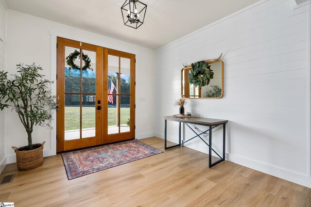 doorway to outside with french doors and light hardwood / wood-style flooring