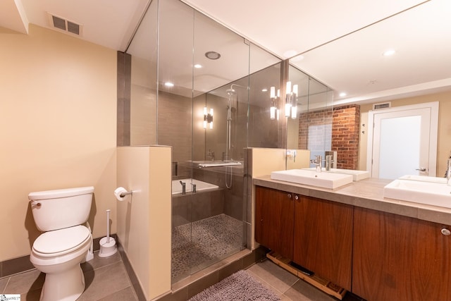 bathroom with toilet, tile patterned flooring, an enclosed shower, and vanity