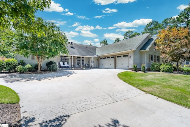 view of front facade featuring a garage, a front lawn, a porch, and concrete driveway