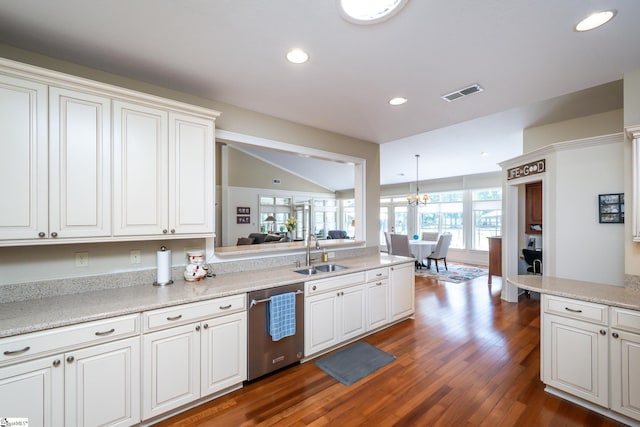 kitchen with dark wood finished floors, light countertops, visible vents, a sink, and dishwasher