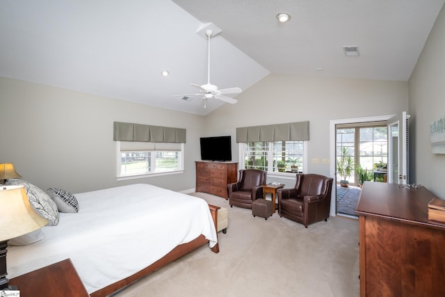 bedroom with vaulted ceiling, multiple windows, access to exterior, and light colored carpet