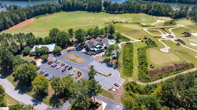 aerial view with a water view and view of golf course