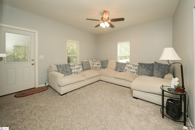 living room featuring light carpet and ceiling fan