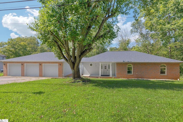 ranch-style house with a garage, a front lawn, concrete driveway, and brick siding