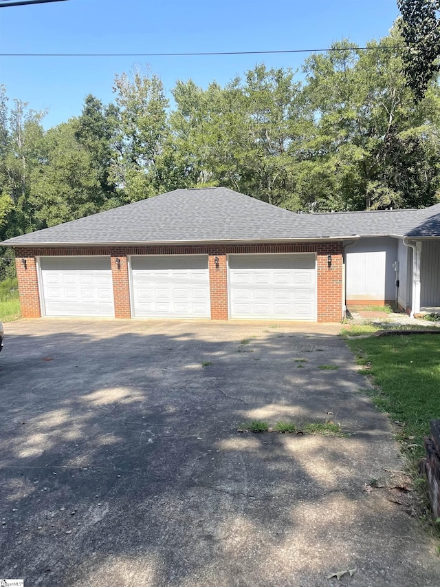 view of side of property with a garage