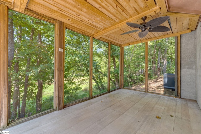 unfurnished sunroom with a wealth of natural light and ceiling fan