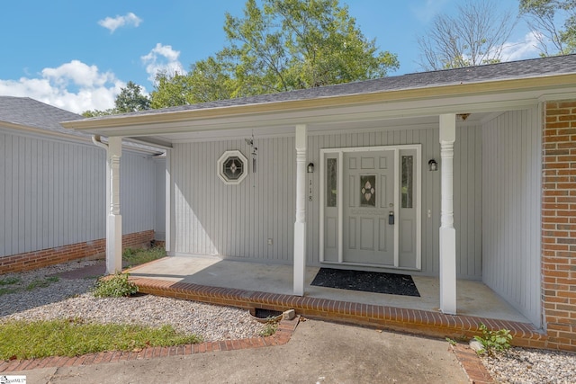 doorway to property with covered porch