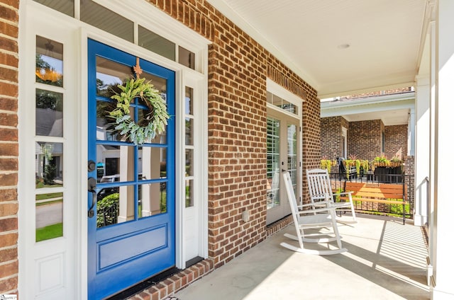 doorway to property with covered porch