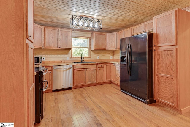 kitchen with light wood-type flooring, stainless steel appliances, light brown cabinetry, sink, and wood ceiling